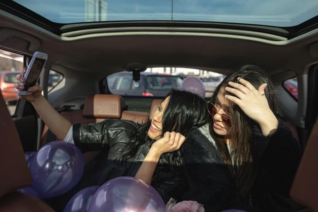 Beautiful young woman celebrating her birthday with a friend,