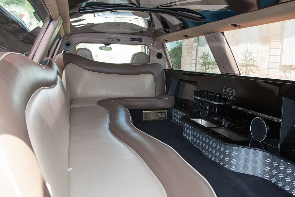 Inside a beautiful limousine white and brown - luxury limo interior