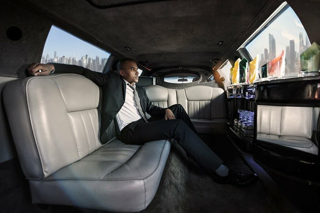 businessman travelling to work in a limousine.