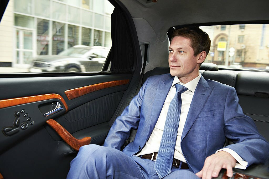 Business man goes to the executive car.
