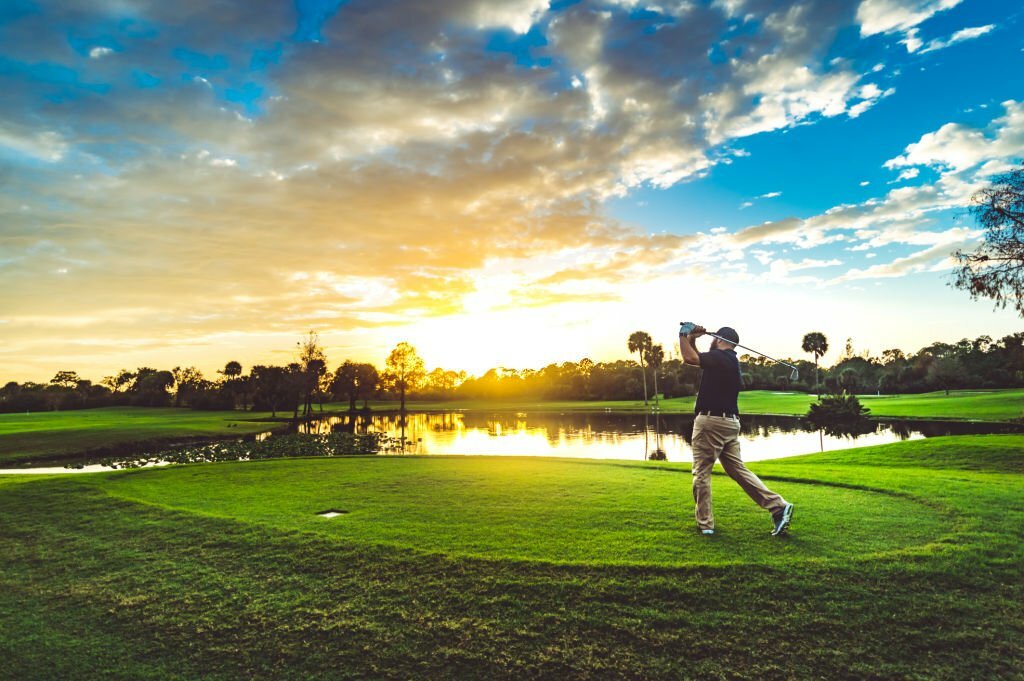 Hire A Limo Service..Man golfing on a golf course.