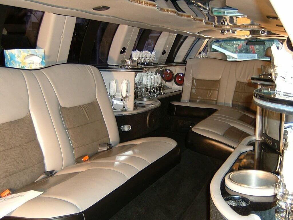 Plush interior of a really long luxury limousine. 