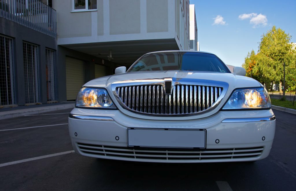 White limousine car in a residential district.